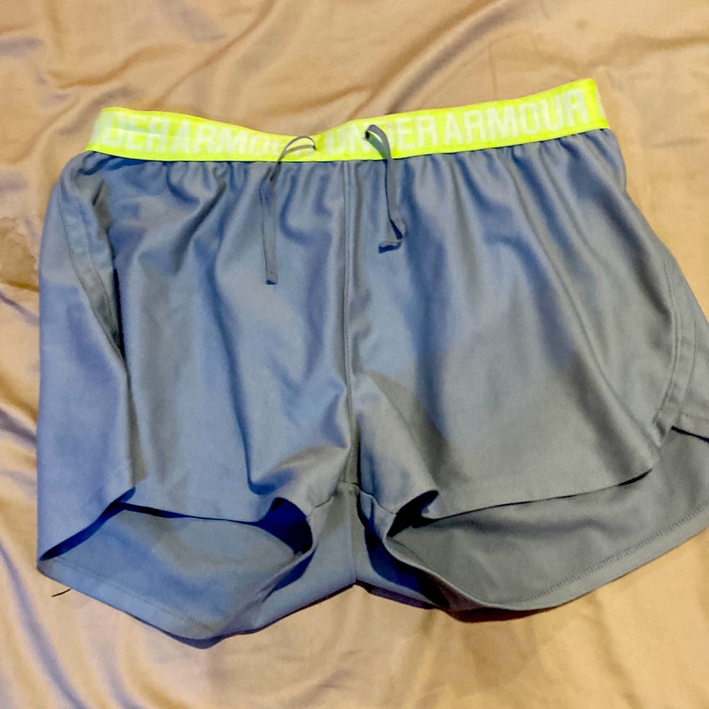 Their yellow and gray athletic shorts their a size large